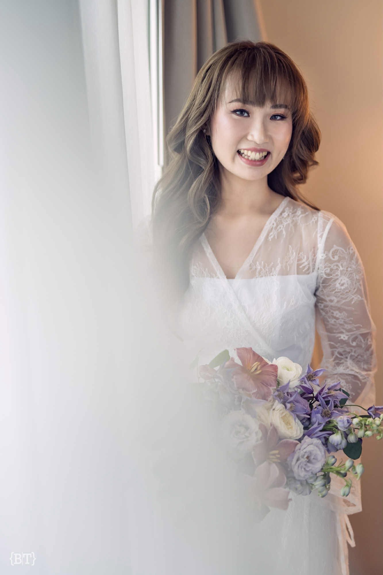 Bride with soft, camera-ready airbrush makeup and a calm expression, moments before her ceremony.