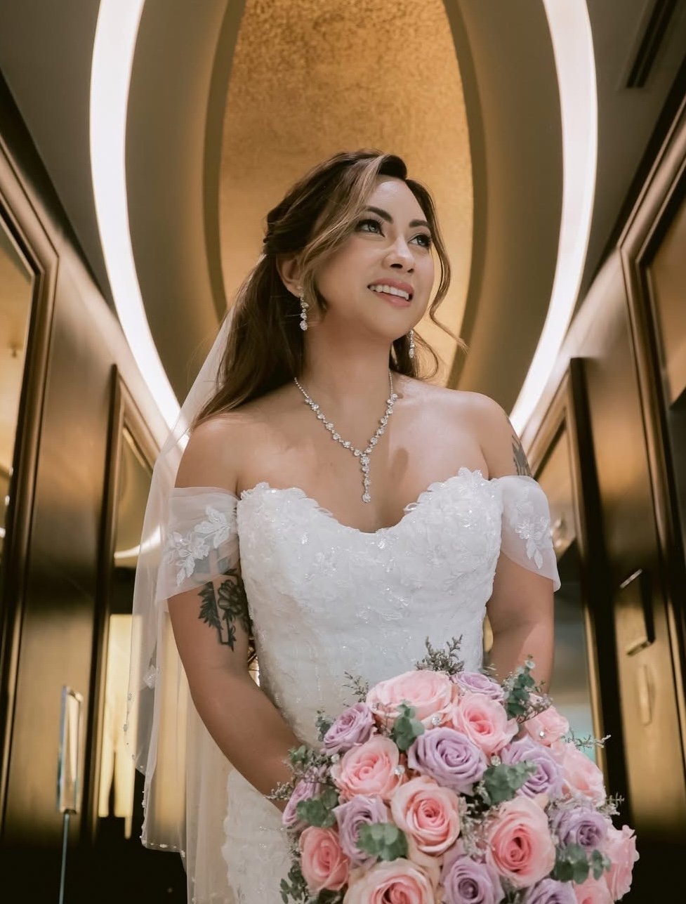 Bridal makeup look with defined eyes and dewy skin.